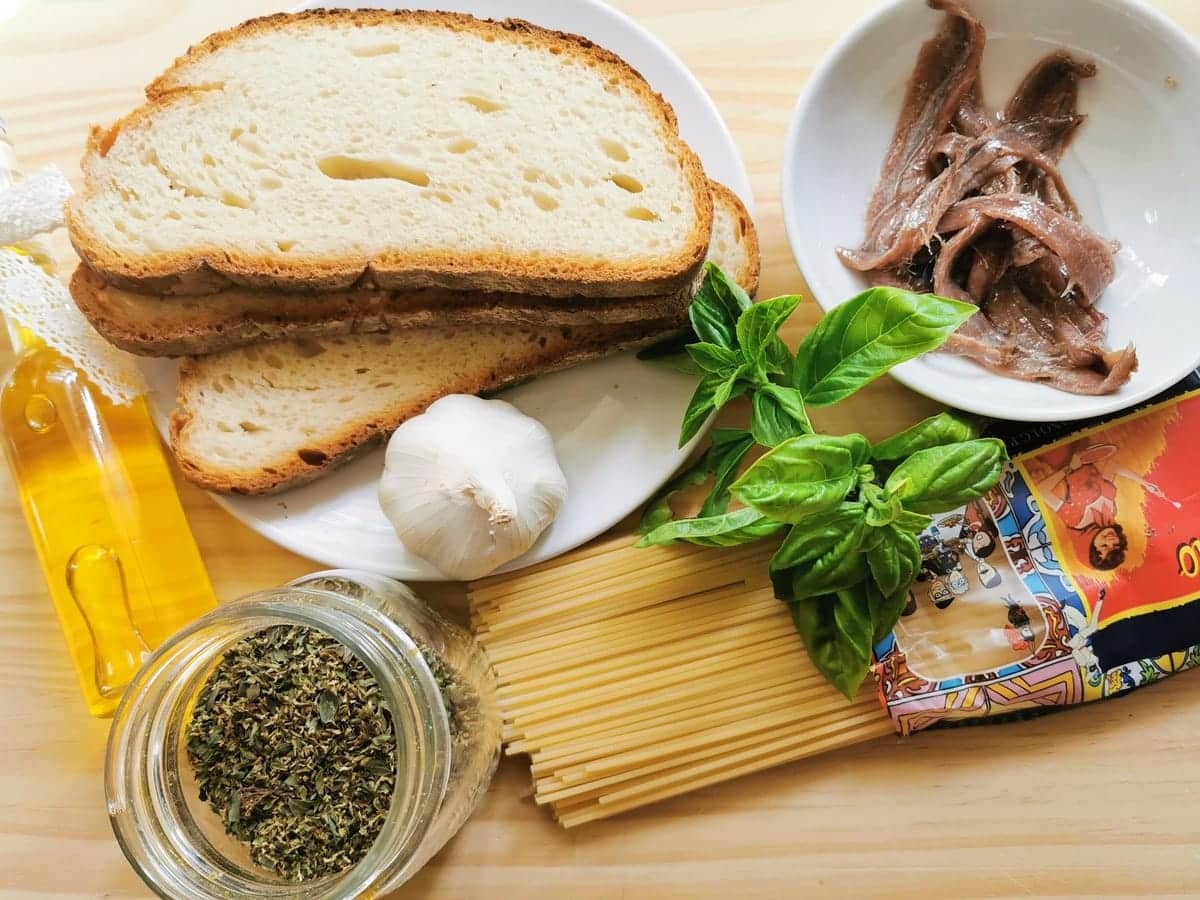 Ingredients for spaghetti alla Gennaro on wood work surface.