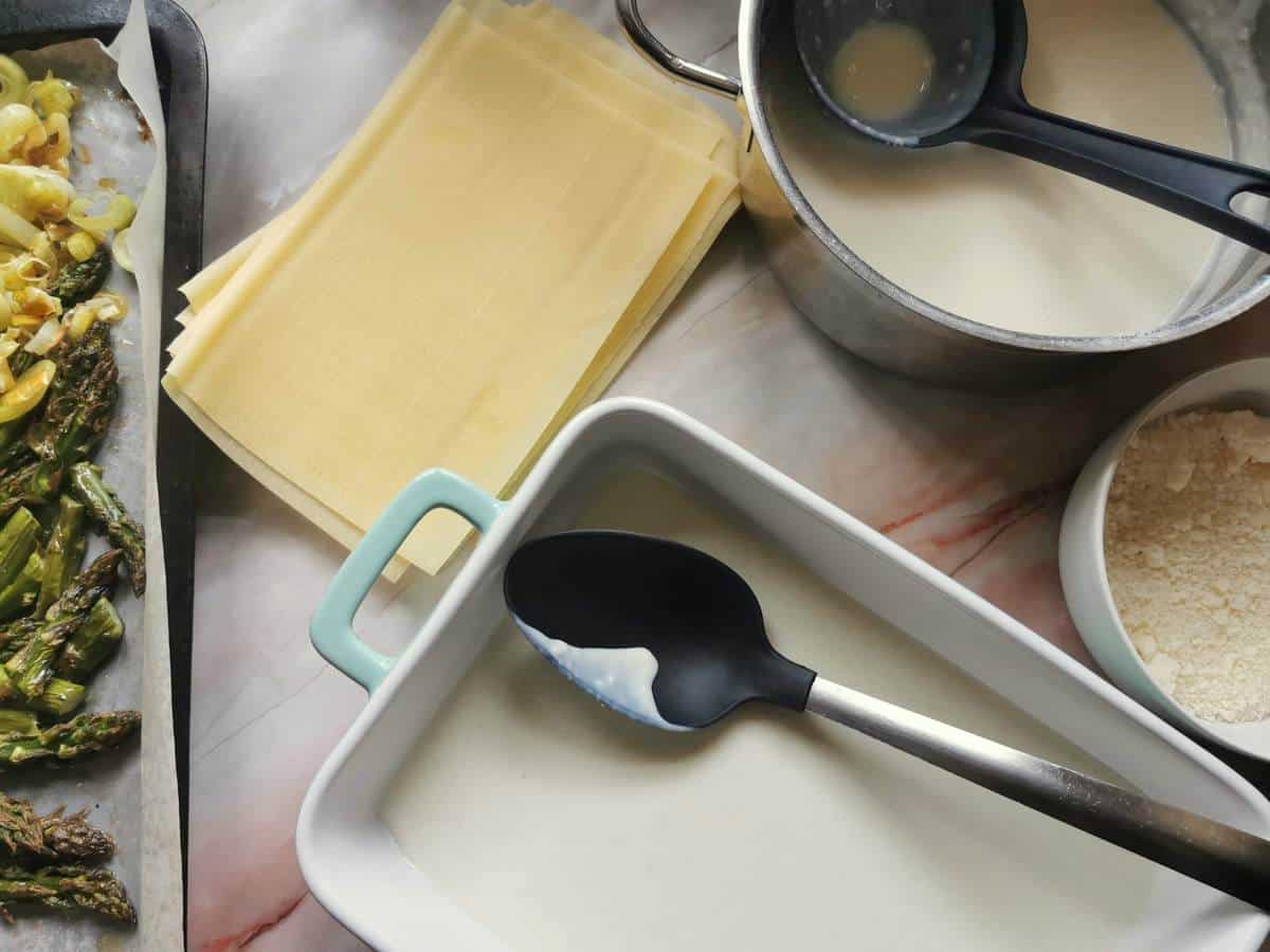 Oven dish with bèchamel spread over the bottom.