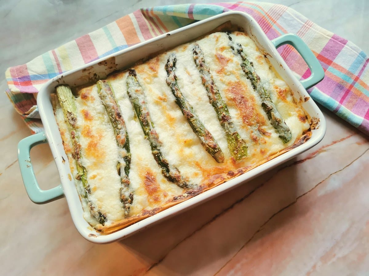 Ready asparagus lasagna in oven dish.
