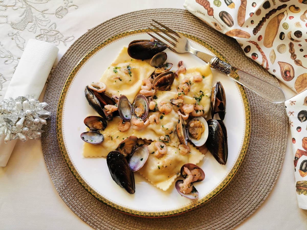 Baked fish ravioli from Liguria on a plate.