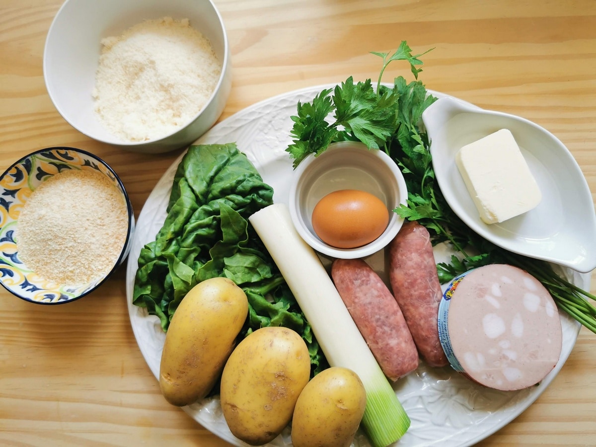 Ingredients for casoncelli della Valcamonica on white plate.