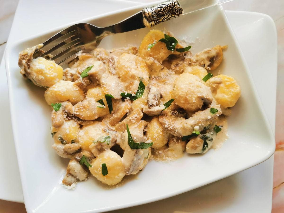 Creamy mushroom gnocchi with stracchino.