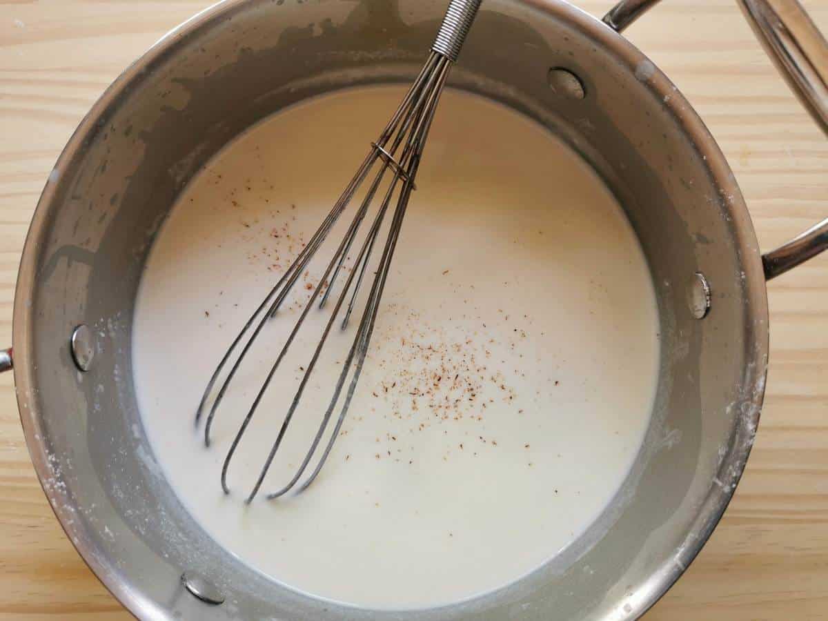 Bechamel sauce in a pot.