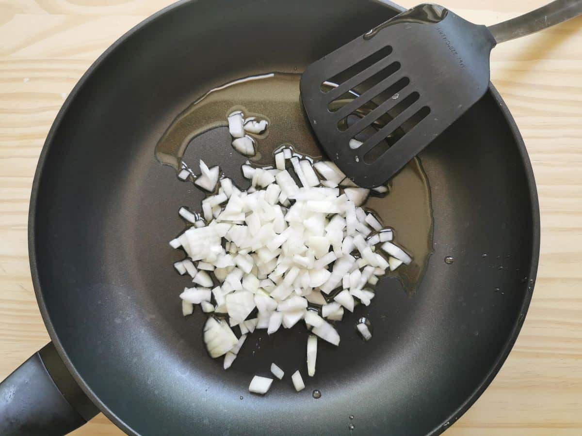 Olive oil in a pan with shallots.