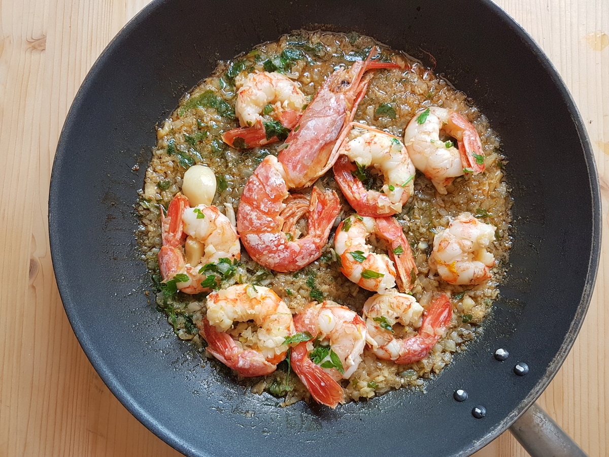 Orange marinade added to the pan with the prawns.