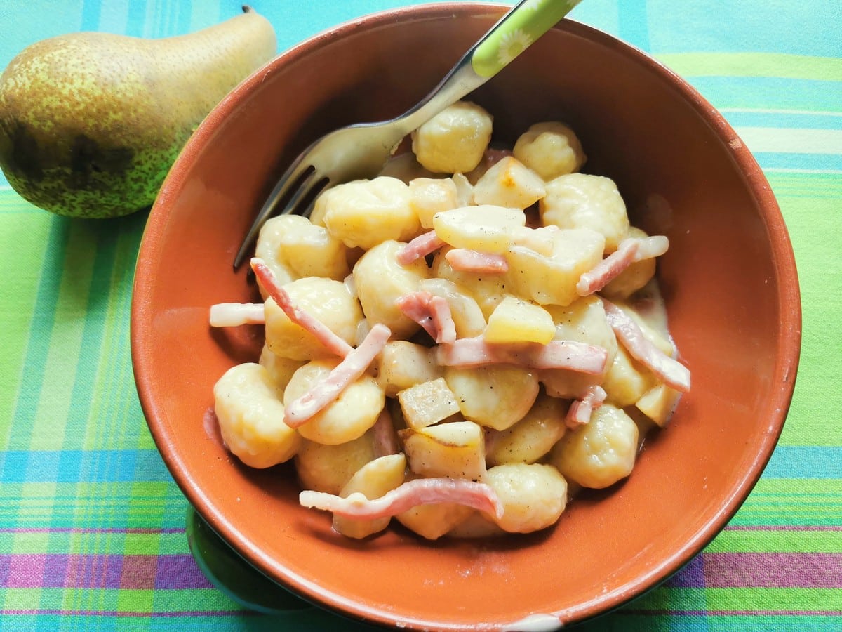 Gnocchi with taleggio from Lombardy in earthenware bowl.