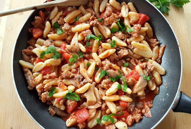 homemade cavatelli pasta with oyster mushrooms and sausage