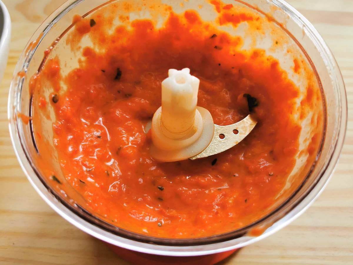 Freshly blended pesto calabrese in a food processor.