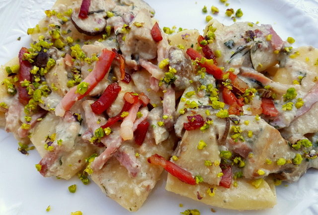 Paccheri with porcini, speck and pistachio