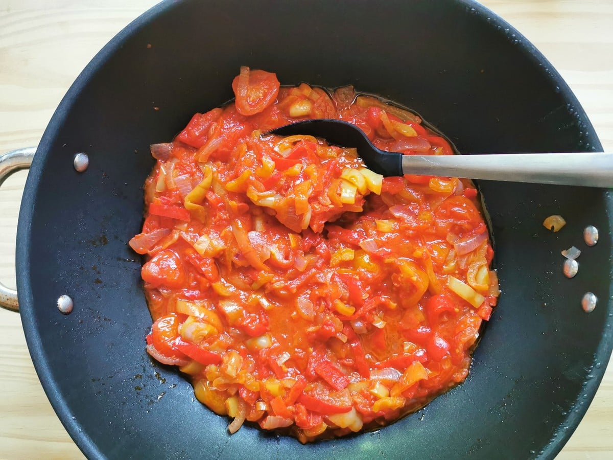 Sweet pepper sauce cooking in a pan.