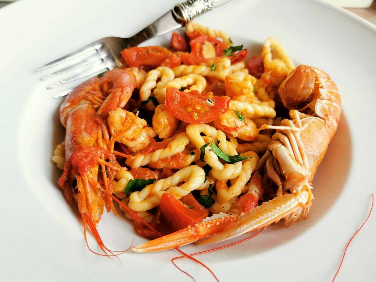 Sardinian lorighittas pasta with shrimp, seafood pasta from Sardinia.