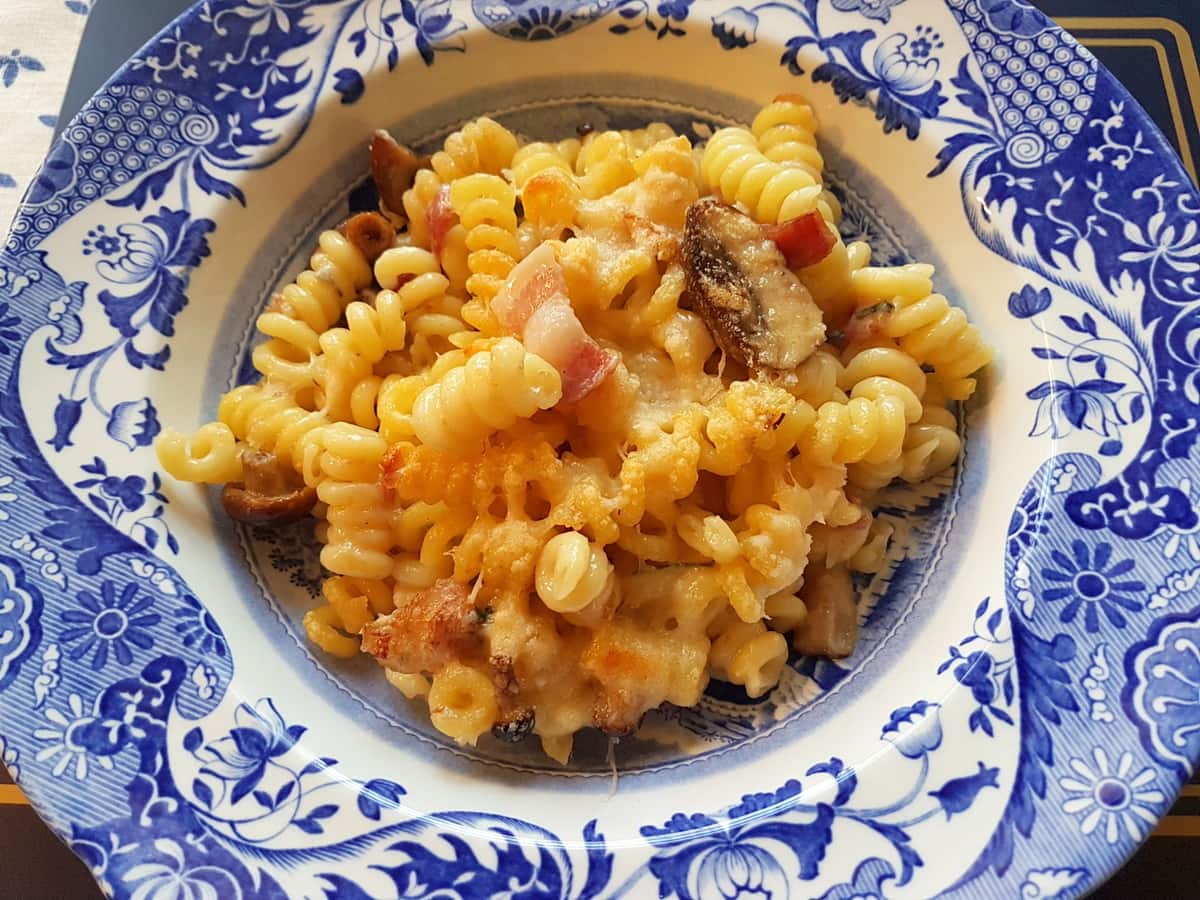 Baked short fusilli bucati with gorgonzola, pancetta and mushrooms.