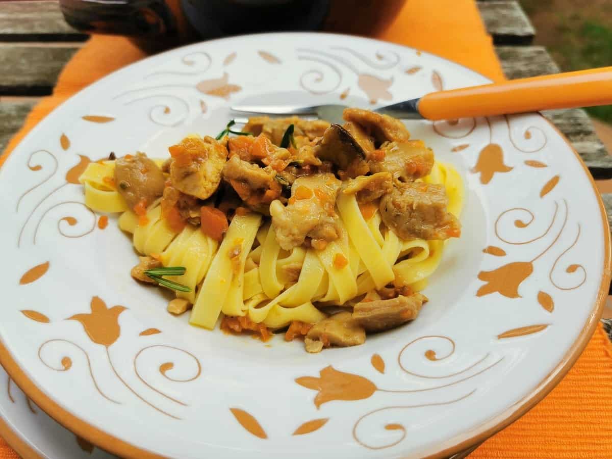 Tagliatelle and rabbit ragu in a bowl.